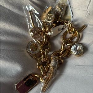 Gold Michael Kors charm bracelet